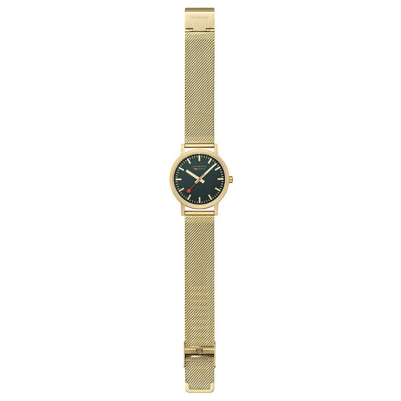 Gold-toned wristwatch with a black dial and mesh metal band.