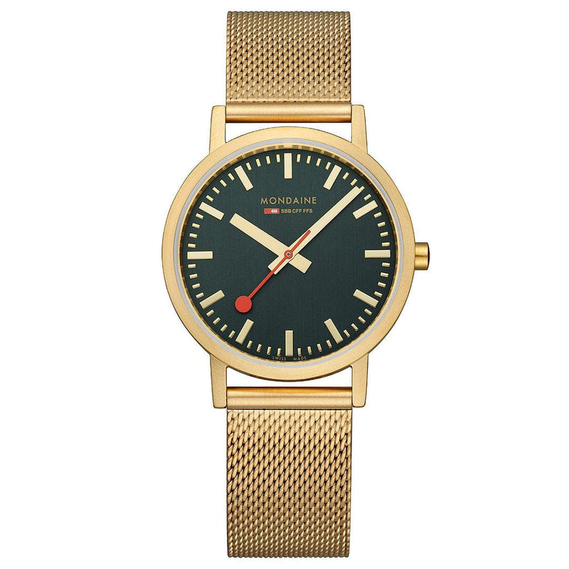 Gold-toned wristwatch with a dark green face and mesh metal band.