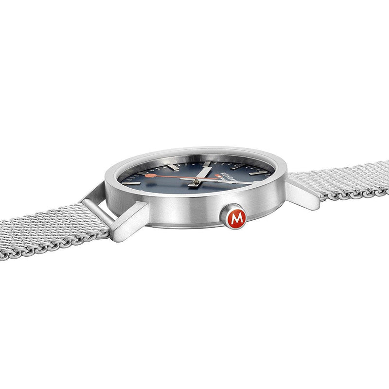 Sleek silver wristwatch with a mesh band and dark face.