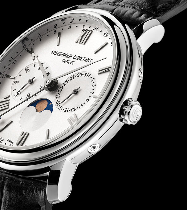 Luxury wristwatch with a white dial featuring multiple complications, including a moon phase indicator.