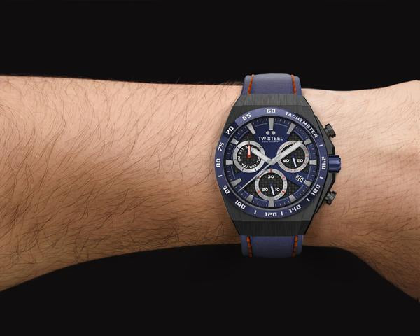 Stylish chronograph wristwatch with a blue dial and multiple subdials worn on a wrist.