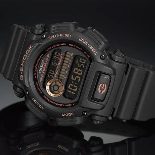 Rugged black digital wristwatch with red accents displaying time and other data.