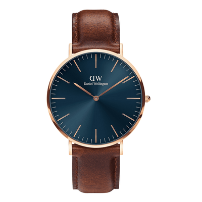 Elegant wristwatch with a blue face, rose gold case, and brown leather strap.