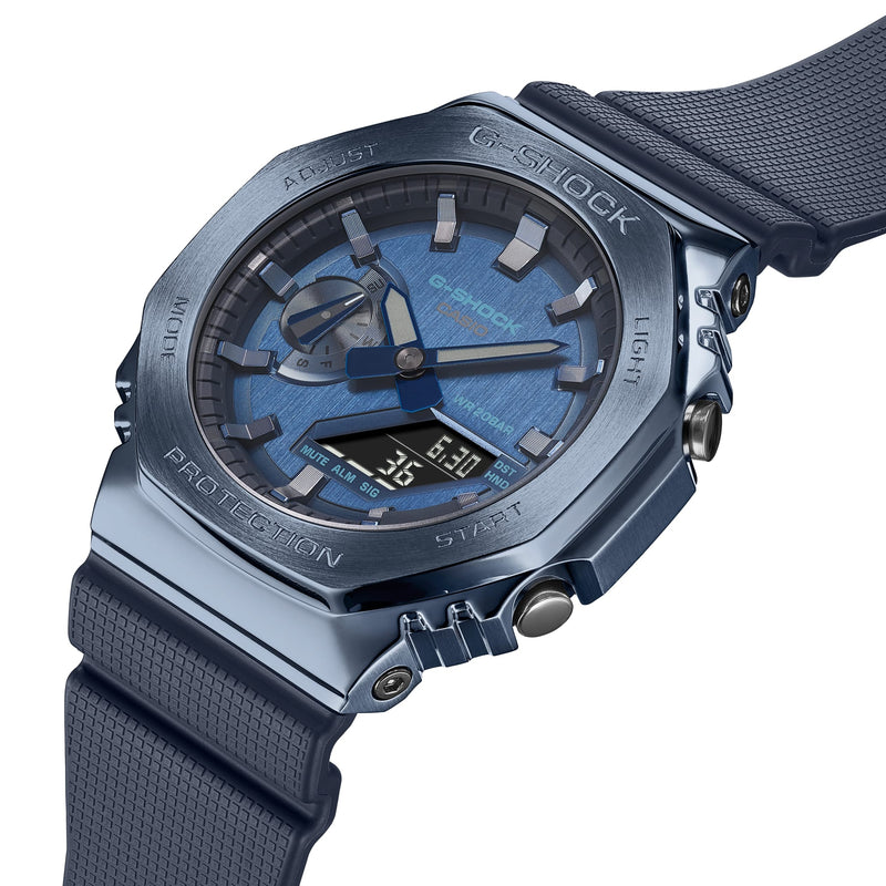 Blue metallic G-Shock wristwatch with analog and digital displays on a black strap.