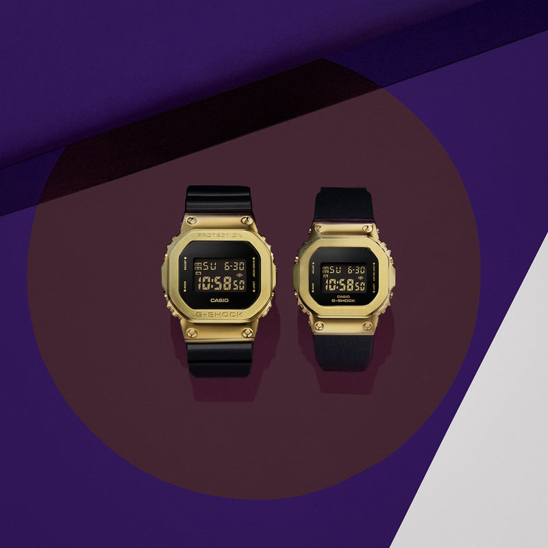 Two gold-colored digital watches with black bands and square faces displaying the time.