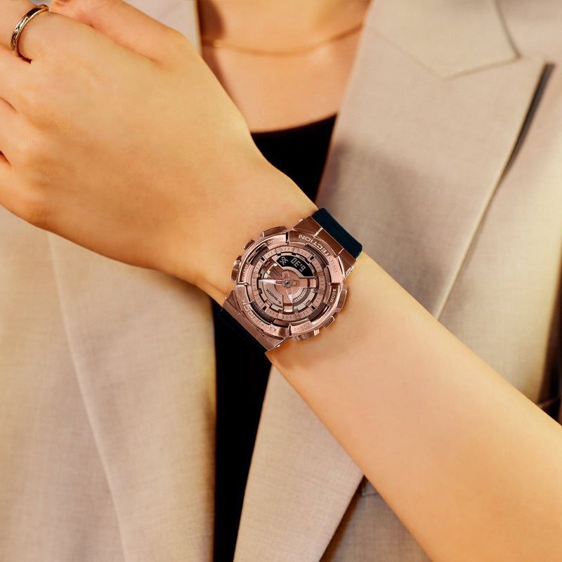 Rose gold wristwatch with a transparent dial and intricate geometric design.