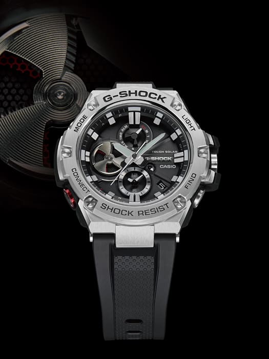 G-Shock watch with a silver metallic case and black rubber strap.