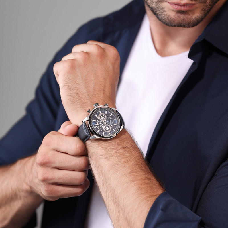 Stylish men’s wristwatch with a dark leather strap and chronograph dial.