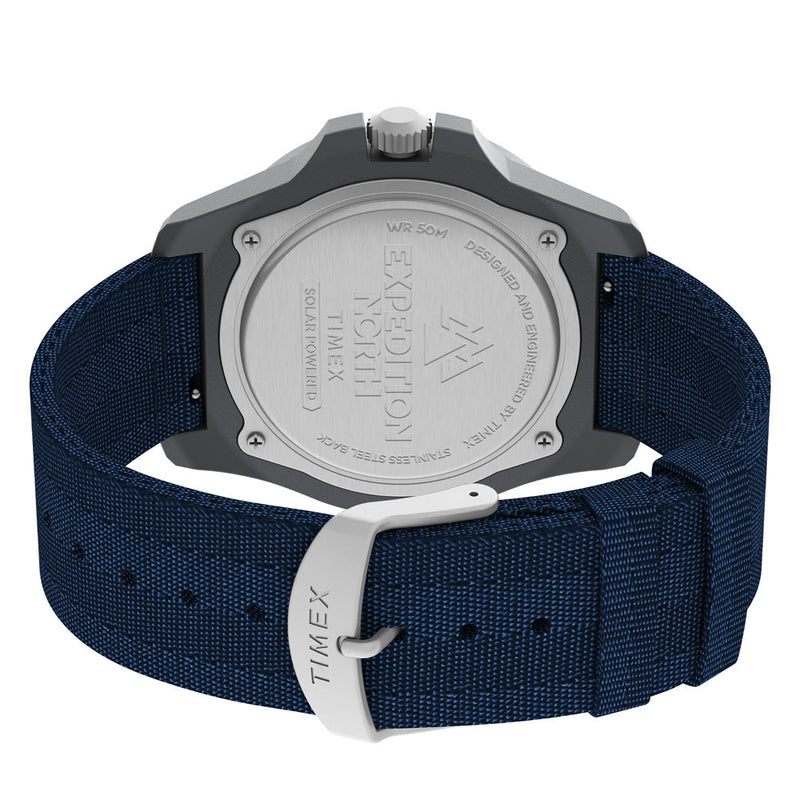 Wristwatch with a navy blue fabric strap and silver-toned case back.