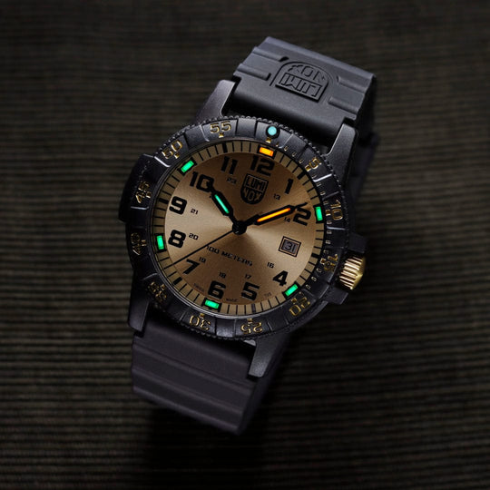 Rugged tactical wristwatch with luminous dial and black rubber strap.