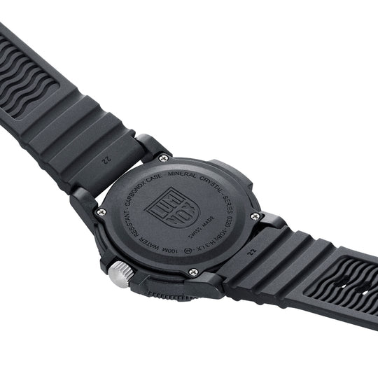 Black wristwatch with a textured rubber strap and a logo on the back case.