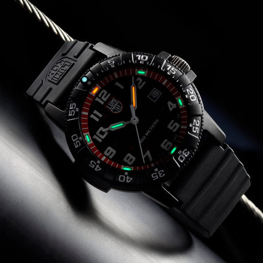 Black tactical wristwatch with colorful markings on the dial and bezel.