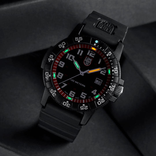 Luminous tactical wristwatch with a black dial and colorful markings.