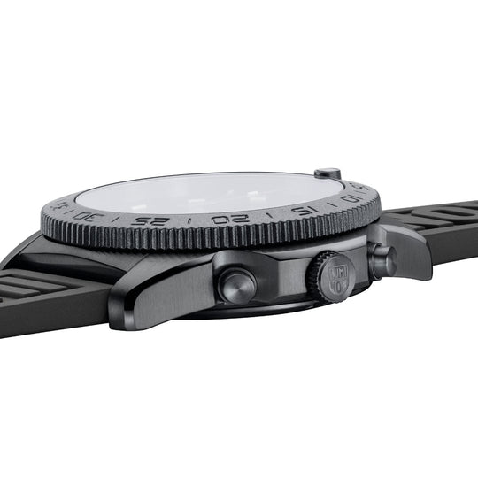 Wristwatch with a textured bezel and black rubber strap.