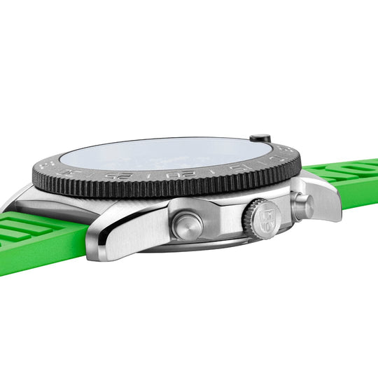 Wristwatch with a bright green strap and silver case.