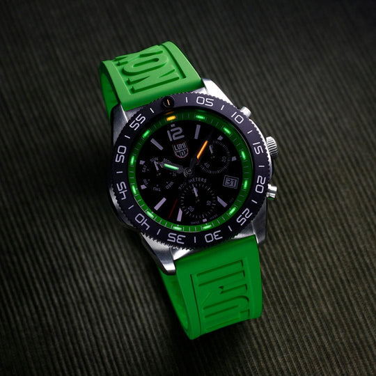 Sporty wristwatch with a black dial, green accents, and a bright green rubber strap.