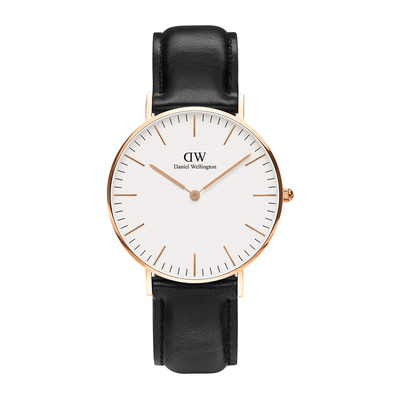 Elegant wristwatch with a white face, rose gold case, and black leather strap.