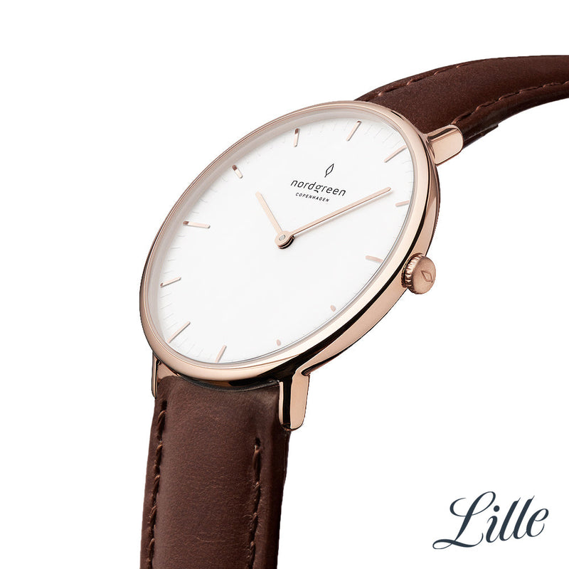 Elegant wristwatch with a white face, rose gold case, and brown leather strap.