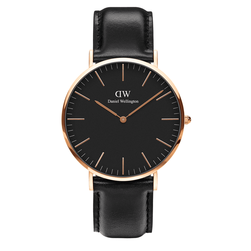 Elegant wristwatch with a black leather strap, black dial, and rose gold-tone case and hands.