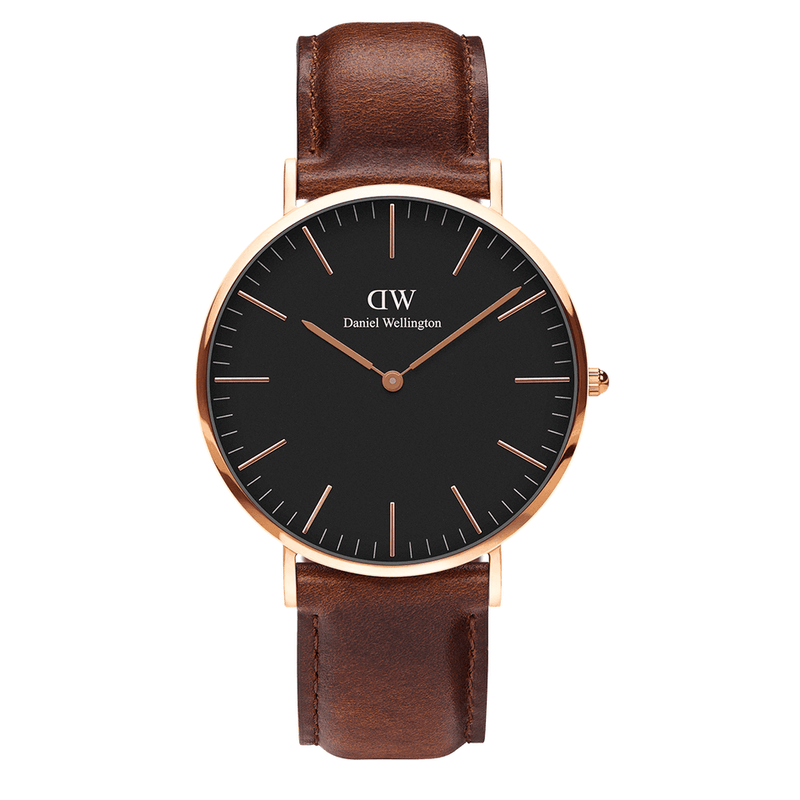 Elegant wristwatch with a black face, rose gold case, and brown leather strap.