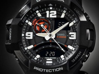 Rugged digital sports watch with analog and digital displays on a black face.